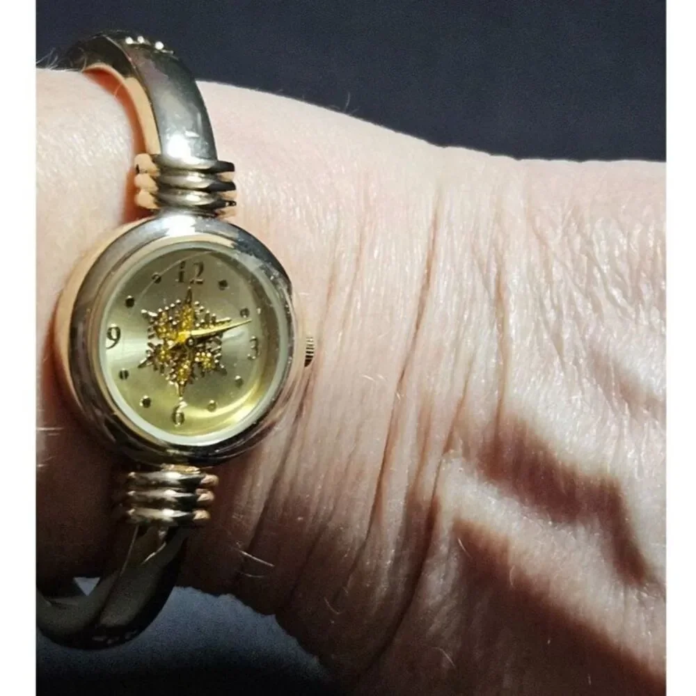 Holiday Lane gold tone snowflake watch